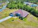 Charming single-story home featuring verdant lawn, tasteful landscaping, and a concrete driveway that extends to an attached two-car garage at 17901 Sw 25Th Avenue Rd, Ocala, FL 34473