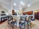 Open kitchen featuring a breakfast bar with seating and pendant lighting at 17901 Sw 25Th Avenue Rd, Ocala, FL 34473