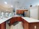 Bright kitchen with a central island, modern appliances, and a seamless flow into the living area at 17901 Sw 25Th Avenue Rd, Ocala, FL 34473