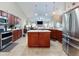 Large kitchen featuring a central island, stainless steel appliances, and ample cabinet space at 17901 Sw 25Th Avenue Rd, Ocala, FL 34473