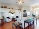 Bright living room with hardwood floors, vaulted ceilings, stylish decor and comfortable seating arrangements at 17901 Sw 25Th Avenue Rd, Ocala, FL 34473