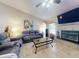 Cozy living room featuring a fireplace, large windows, and comfortable seating at 17901 Sw 25Th Avenue Rd, Ocala, FL 34473