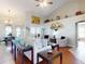 Open-concept living room features hardwood floors, large windows, comfortable seating, and stylish decor at 17901 Sw 25Th Avenue Rd, Ocala, FL 34473
