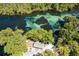 Stunning aerial view of the property showcasing the picturesque river and lush greenery at 21939 Sw 85Th Loop, Dunnellon, FL 34431