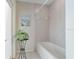 Clean, well-lit bathroom featuring a bathtub and neutral tile at 21939 Sw 85Th Loop, Dunnellon, FL 34431