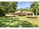 Lovely one-story home with a charming, well-maintained lawn and mature landscaping at 21939 Sw 85Th Loop, Dunnellon, FL 34431
