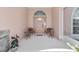 Charming front porch with seating and an arched doorway at 21939 Sw 85Th Loop, Dunnellon, FL 34431