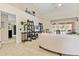 Open-concept living room with tall ceilings, stylish decor, and a view of the pool at 21939 Sw 85Th Loop, Dunnellon, FL 34431