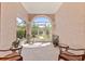 Relaxing patio area with comfortable seating and views of the garden at 21939 Sw 85Th Loop, Dunnellon, FL 34431