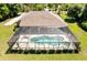 A screened-in pool with an attached spa at 21939 Sw 85Th Loop, Dunnellon, FL 34431