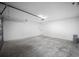 Spacious two car garage with white walls and concrete flooring, ready for storage and vehicles at 24354 Nw Water Oak Ave, Dunnellon, FL 34431
