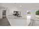 Bright kitchen features an island sink, granite countertops, and stainless appliances at 24354 Nw Water Oak Ave, Dunnellon, FL 34431