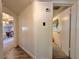 Hallway with neutral walls that leads to a bedroom and other rooms at 25292 Ne 132Nd Ln, Fort Mc Coy, FL 32134