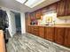 Kitchen with wooden cabinets, a skylight, and an adjoining door to the bathroom at 25292 Ne 132Nd Ln, Fort Mc Coy, FL 32134