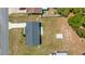 This aerial view showcases the home, storage shed, and fenced backyard at 2705 Sw 156Th Lane Rd, Ocala, FL 34473