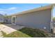 The backyard includes a small concrete patio, accessible through a sliding glass door at 2705 Sw 156Th Lane Rd, Ocala, FL 34473