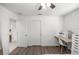 Simple bedroom showcasing natural light, a desk, and closet space, suitable for work or rest at 2705 Sw 156Th Lane Rd, Ocala, FL 34473