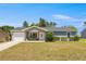 Charming one-story home with a well-manicured front yard, inviting entrance, and attached garage at 2705 Sw 156Th Lane Rd, Ocala, FL 34473