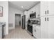 Modern kitchen featuring white cabinets and stainless steel appliances at 2705 Sw 156Th Lane Rd, Ocala, FL 34473