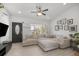 Bright living room showcasing a large sectional sofa, stylish front door, and plenty of natural light at 2705 Sw 156Th Lane Rd, Ocala, FL 34473