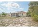Backyard view with solar panels, screened in patio, and plenty of open space at 2730 Sw 162Nd Street Rd, Ocala, FL 34473