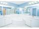Well-lit, luxury Primary bath has dual sinks, a glass shower, and a large soaking tub at 2730 Sw 162Nd Street Rd, Ocala, FL 34473