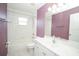 Bright bathroom with a shower and bath combo, white vanity and a single window at 2730 Sw 162Nd Street Rd, Ocala, FL 34473