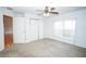 This bedroom features large double closets, plush carpet, and a large window with blinds at 2730 Sw 162Nd Street Rd, Ocala, FL 34473