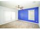 Bedroom with carpeted floor, two-tone paint, large windows, and a ceiling fan at 2730 Sw 162Nd Street Rd, Ocala, FL 34473