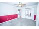 This bedroom has an accent wall, plush carpet, mirrored closet doors, and a ceiling fan at 2730 Sw 162Nd Street Rd, Ocala, FL 34473