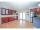 Dining area with hardwood floors, stylish cabinetry, and easy access to the kitchen at 2730 Sw 162Nd Street Rd, Ocala, FL 34473