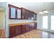 Dining room showcasing hardwood floors, custom cabinetry, and a view to the outside patio at 2730 Sw 162Nd Street Rd, Ocala, FL 34473
