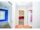 Hallway leads to a bedroom on the left and a bathroom on the right, with hardwood floors throughout at 2730 Sw 162Nd Street Rd, Ocala, FL 34473