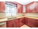 Updated kitchen with mosaic backsplash, butcher block counters and stainless steel appliances at 2730 Sw 162Nd Street Rd, Ocala, FL 34473
