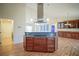 Kitchen featuring center island, wood floors, and stainless steel appliances at 2730 Sw 162Nd Street Rd, Ocala, FL 34473