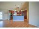 Modern kitchen featuring stainless steel appliances and an island with hanging lights at 2730 Sw 162Nd Street Rd, Ocala, FL 34473