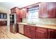 Updated kitchen with new stainless steel appliances and hardwood floors at 2730 Sw 162Nd Street Rd, Ocala, FL 34473