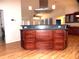 Spacious kitchen island with granite countertop, wood cabinets, and stainless steel appliances at 2730 Sw 162Nd Street Rd, Ocala, FL 34473