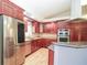 Modern kitchen with stainless appliances and granite countertops at 2730 Sw 162Nd Street Rd, Ocala, FL 34473
