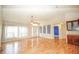 Bright living room featuring hardwood flooring, natural light, and a view of the front entry at 2730 Sw 162Nd Street Rd, Ocala, FL 34473