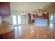Open-concept living space with kitchen island and stainless steel appliances at 2730 Sw 162Nd Street Rd, Ocala, FL 34473