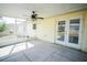Covered patio featuring concrete floors, a ceiling fan and easy access to the backyard at 2730 Sw 162Nd Street Rd, Ocala, FL 34473