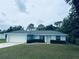 Charming one-story home featuring an attached two-car garage and manicured landscaping at 38 Laurel Ct, Ocala, FL 34480