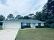 Charming one-story home featuring an attached two-car garage and manicured landscaping at 38 Laurel Ct, Ocala, FL 34480