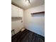 Functional laundry room featuring cabinetry, washer/dryer hookups, and laminate flooring at 38 Laurel Ct, Ocala, FL 34480