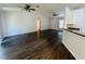 Spacious living room featuring vaulted ceiling, ceiling fan, wood floors and abundant natural light at 38 Laurel Ct, Ocala, FL 34480