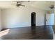 Open living room featuring vaulted ceilings, hardwood floors, and a bright, airy atmosphere at 38 Laurel Ct, Ocala, FL 34480