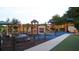 Community playground with multiple slides, climbing structures, and a safe, padded play area at 38 Laurel Ct, Ocala, FL 34480