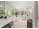 Spacious bathroom with dual sinks, a large mirror, and separate shower at 4424 Se 14Th St, Ocala, FL 34471