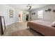 Spacious bedroom with neutral walls, carpeted floors, ceiling fan, and ample natural light at 4424 Se 14Th St, Ocala, FL 34471